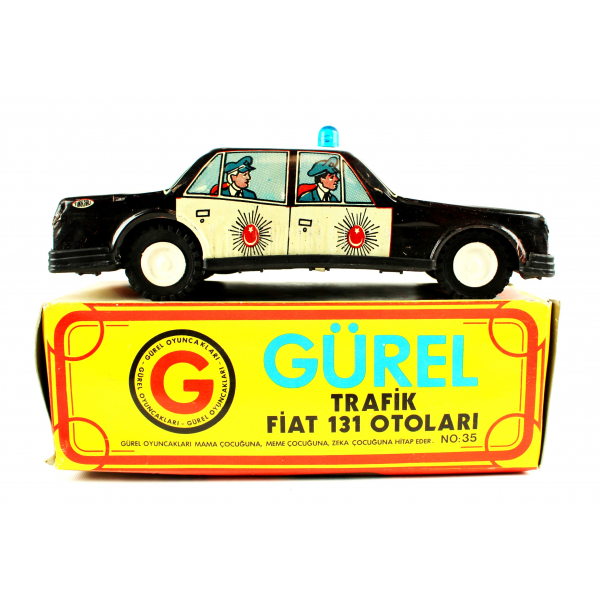 Gürel marka yerli oyuncak, sürtmeli trafik polisi, teneke, mavi tepe lambalı, 1980'ler, kendi kutusunda, 19x7,5cm
